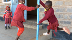 5 year old girl at classroom door